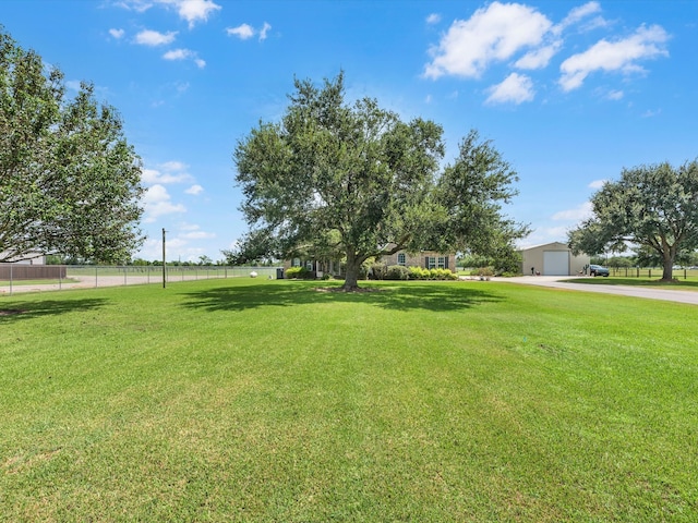 view of yard featuring an outbuilding and a garage