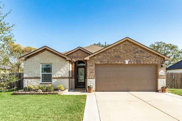 view of front of property with a front lawn and a garage