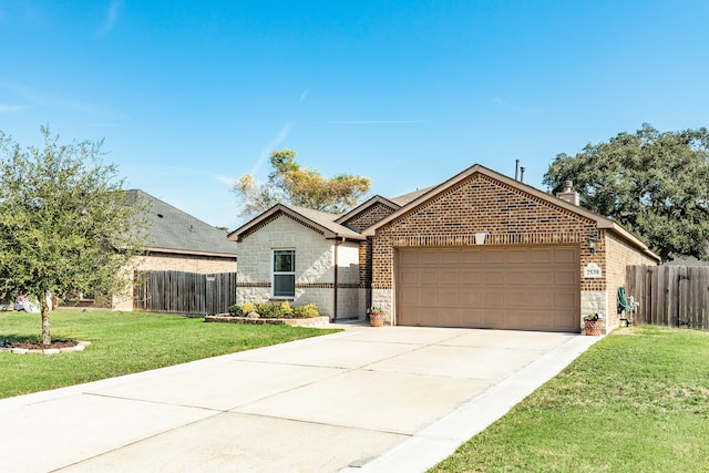 view of front facade featuring a garage and a front lawn