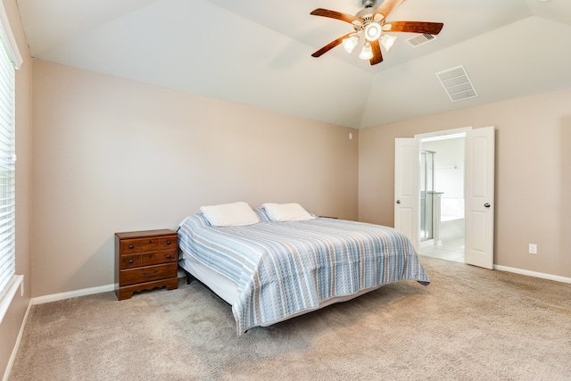 carpeted bedroom with ceiling fan, vaulted ceiling, and multiple windows