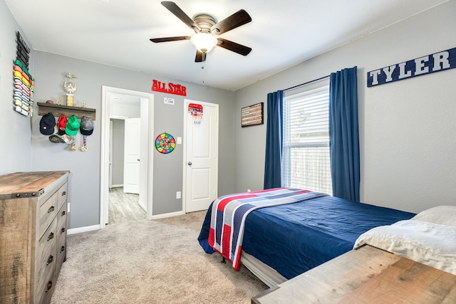 bedroom with ceiling fan and light colored carpet