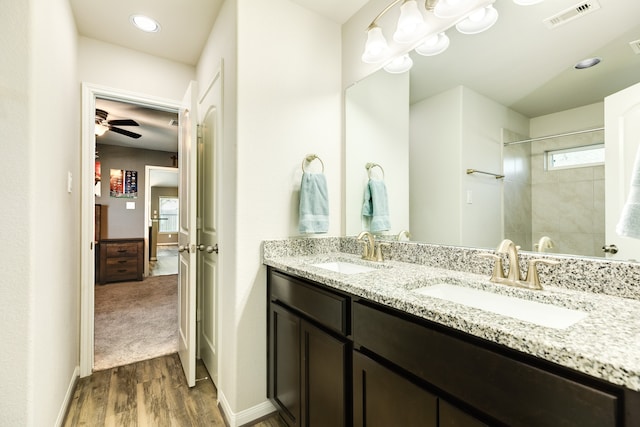 bathroom featuring vanity, hardwood / wood-style flooring, and ceiling fan