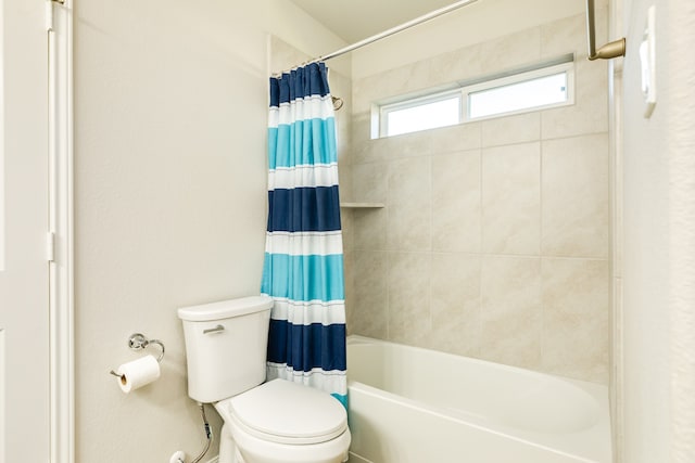 bathroom with toilet and shower / tub combo with curtain