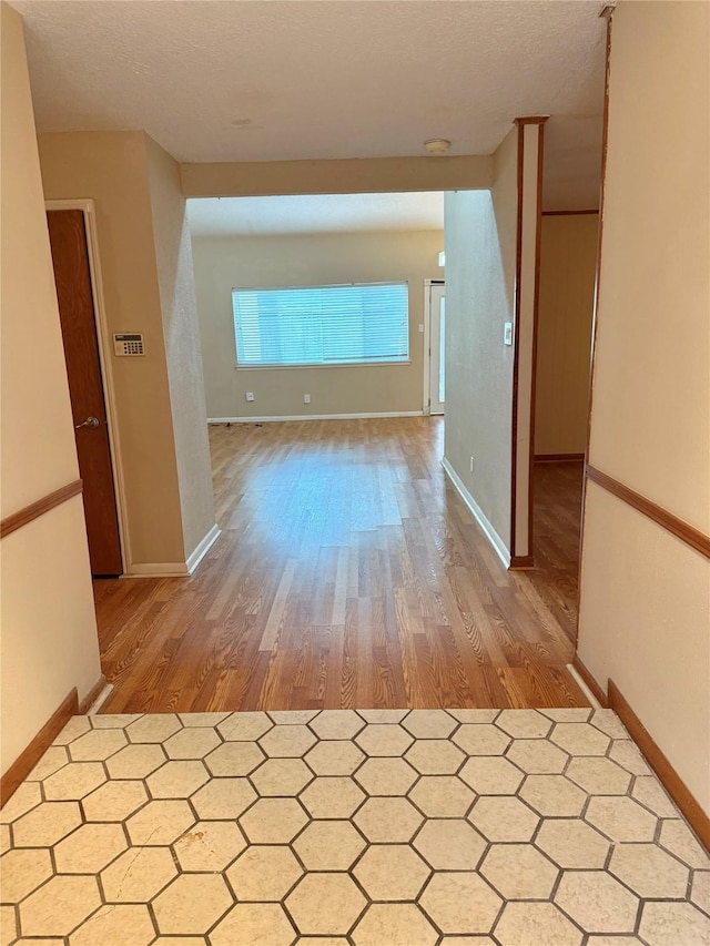 hall with light wood-type flooring