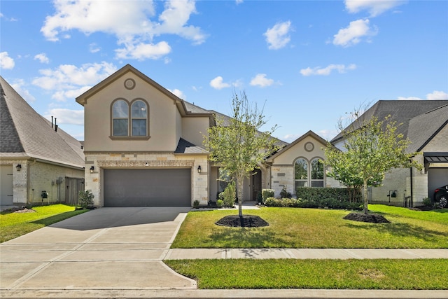 view of front of house featuring a front yard and a garage