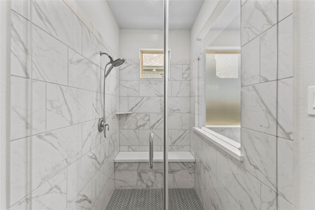 bathroom with a shower with shower door