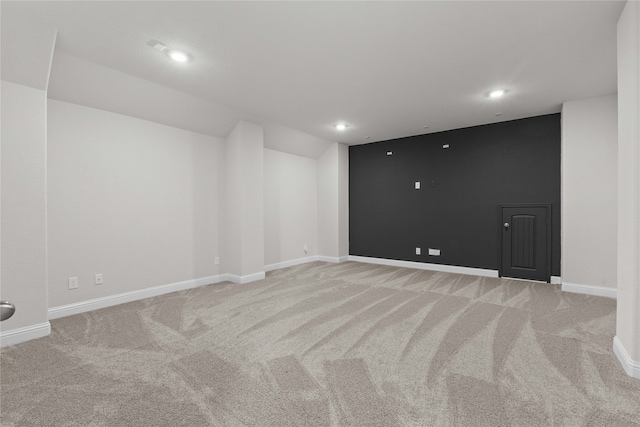 unfurnished room with light carpet