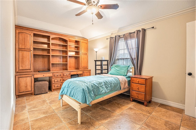 bedroom featuring ceiling fan, lofted ceiling, and ornamental molding