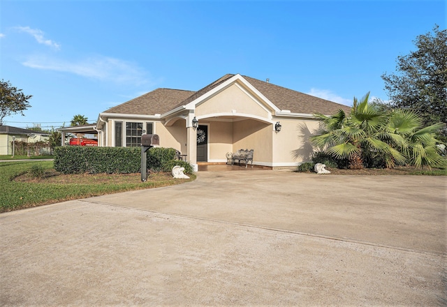 ranch-style home with a carport