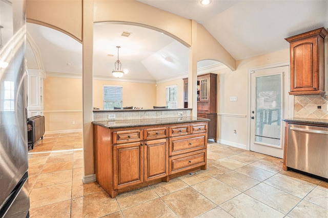 kitchen featuring stainless steel appliances, pendant lighting, vaulted ceiling, decorative backsplash, and ornamental molding