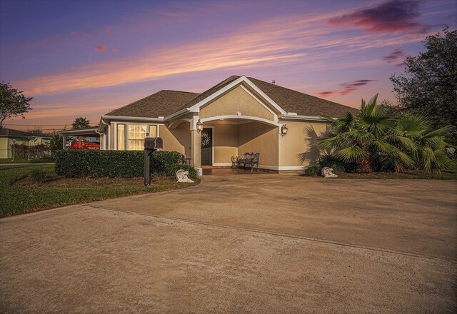 single story home with a carport