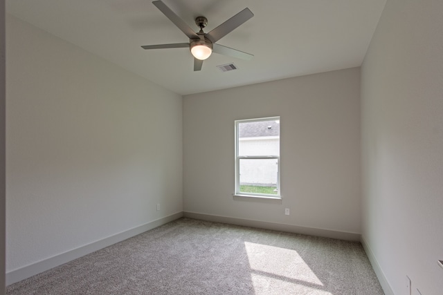 carpeted empty room with ceiling fan