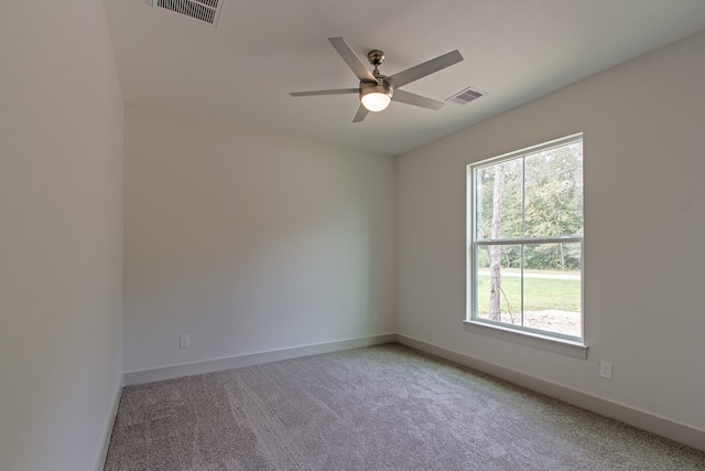 spare room with carpet flooring and ceiling fan