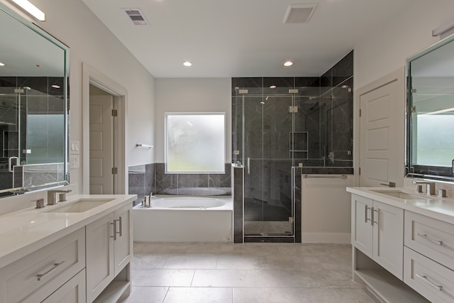 bathroom featuring tile patterned flooring, vanity, and independent shower and bath