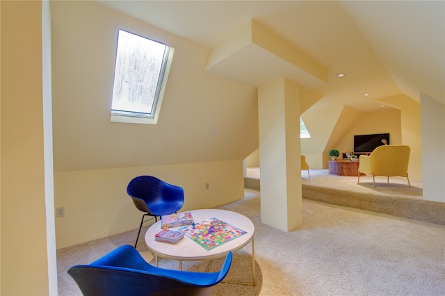 recreation room featuring light colored carpet and lofted ceiling