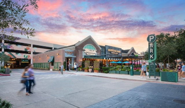 view of outdoor building at dusk