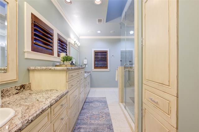 bathroom with tile patterned floors, vanity, ornamental molding, and walk in shower