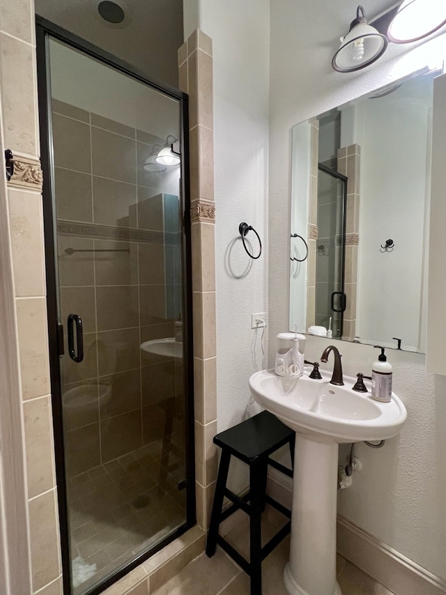 bathroom with a shower with shower door