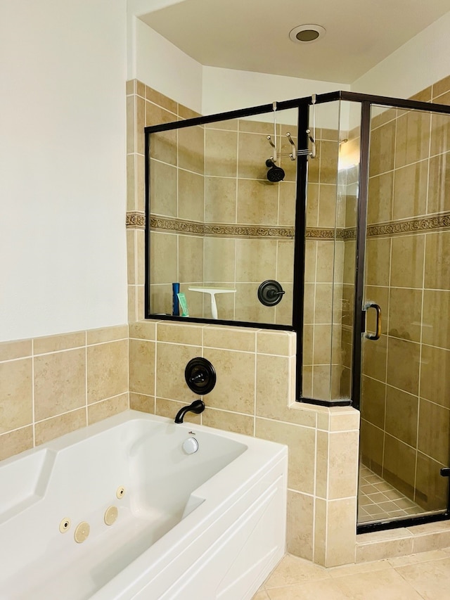 bathroom featuring plus walk in shower and tile patterned floors