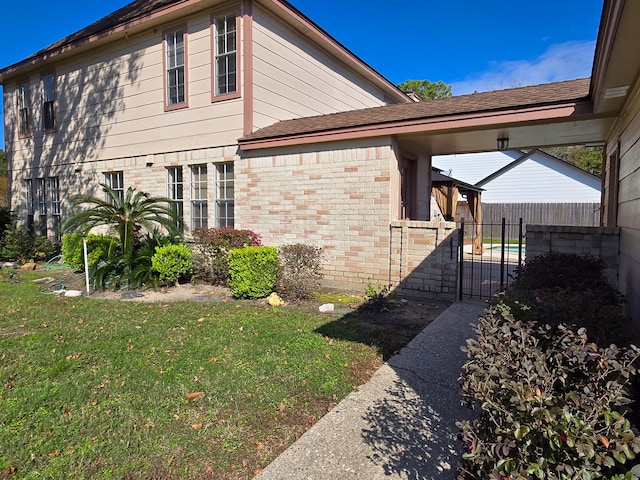 view of home's exterior with a yard