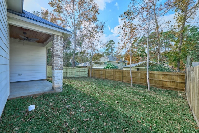 view of yard featuring ceiling fan