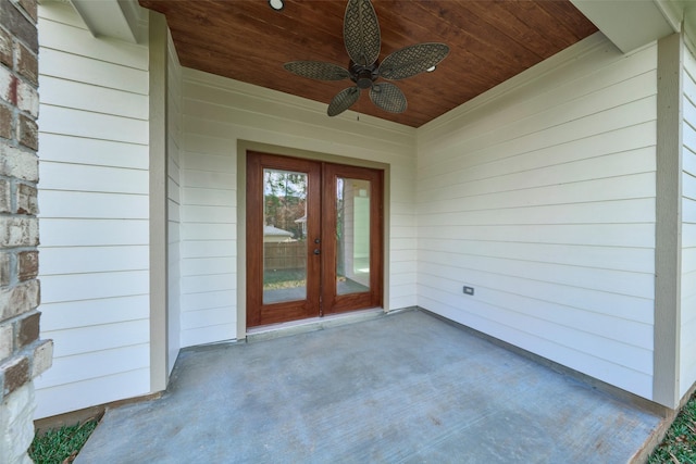 view of exterior entry with french doors and ceiling fan