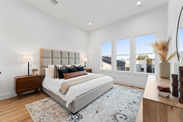 bedroom with light hardwood / wood-style flooring