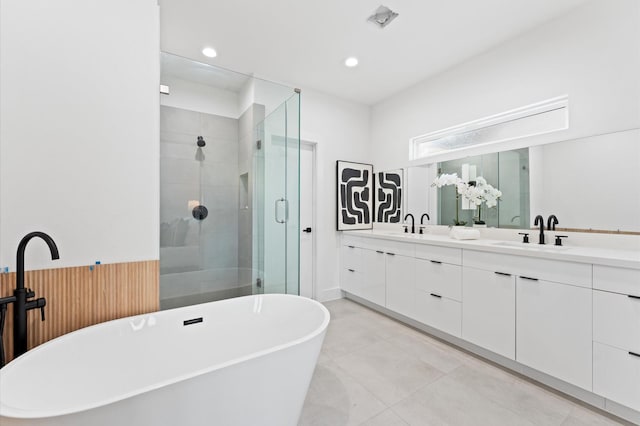 bathroom featuring plus walk in shower and vanity