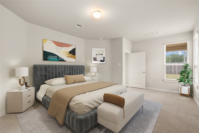 bedroom featuring light colored carpet