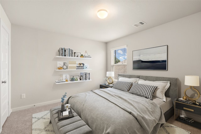 bedroom featuring light colored carpet