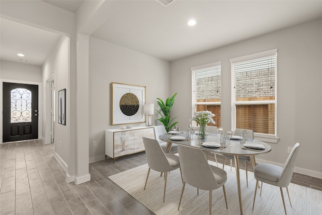 dining space with dark hardwood / wood-style floors