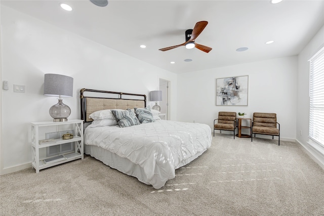 bedroom featuring carpet, multiple windows, and ceiling fan