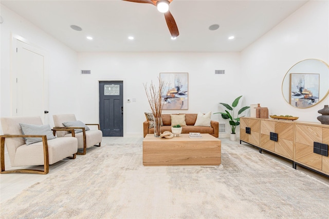 living room featuring carpet flooring and ceiling fan