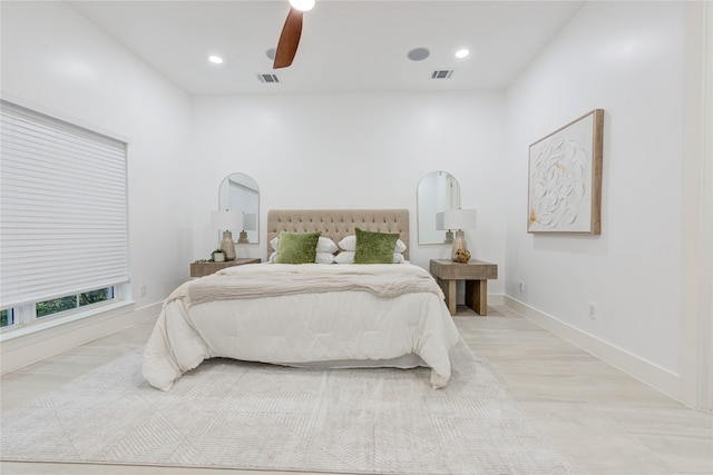 bedroom with ceiling fan and light wood-type flooring