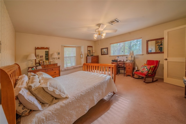 carpeted bedroom with ceiling fan