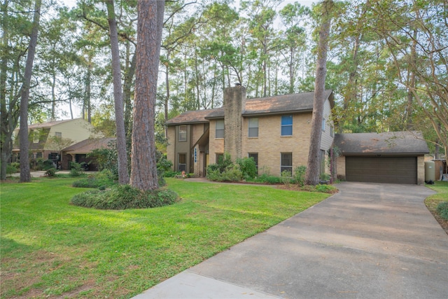 view of front of home featuring a garage and a front lawn