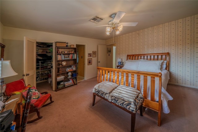 bedroom featuring ceiling fan and carpet