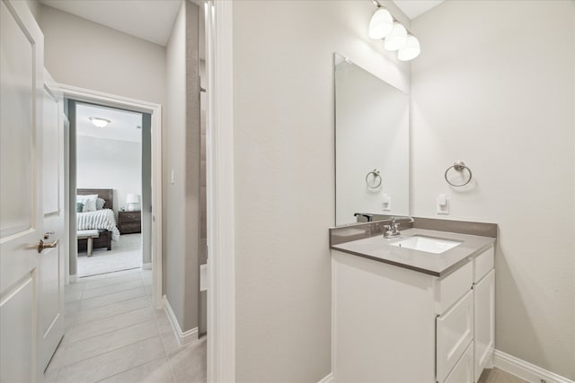 bathroom featuring tile patterned floors and vanity