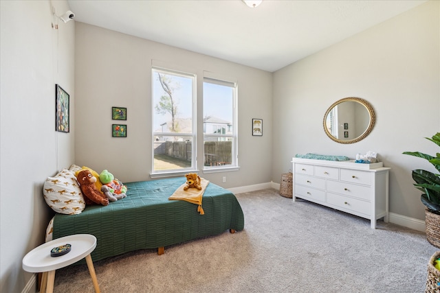 bedroom with light colored carpet