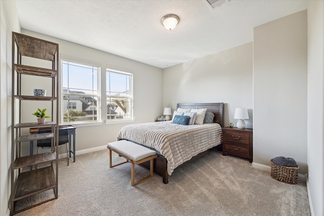 bedroom with light carpet