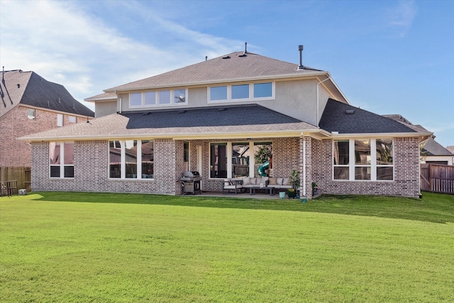 back of house featuring fence, an outdoor living space, a yard, stucco siding, and a patio area