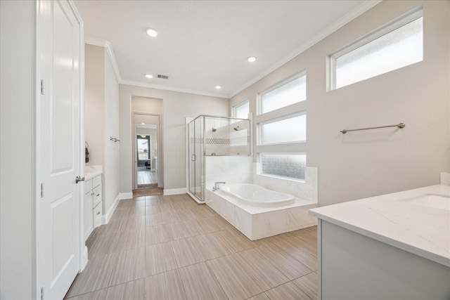 bathroom with a garden tub, visible vents, vanity, a shower stall, and crown molding