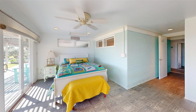 bedroom featuring brick wall, access to outside, and ceiling fan