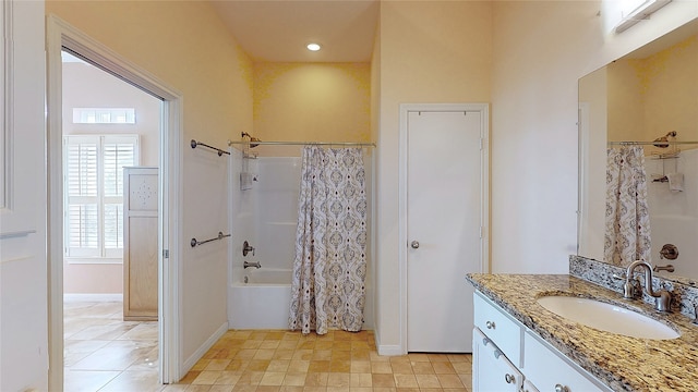 bathroom featuring shower / bath combo and vanity