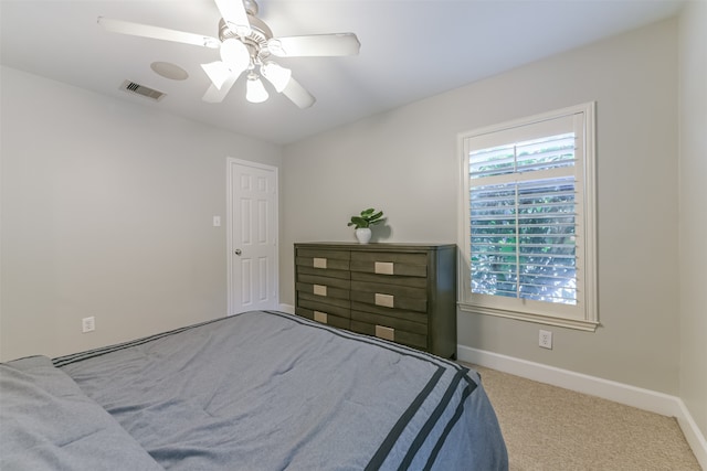 bedroom featuring ceiling fan and light colored carpet