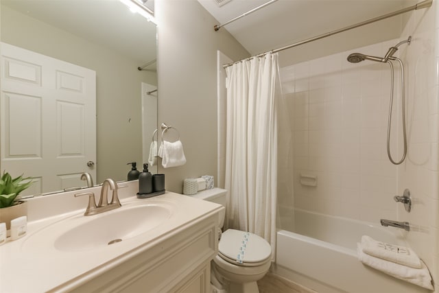 full bathroom featuring vanity, shower / bath combination with curtain, and toilet