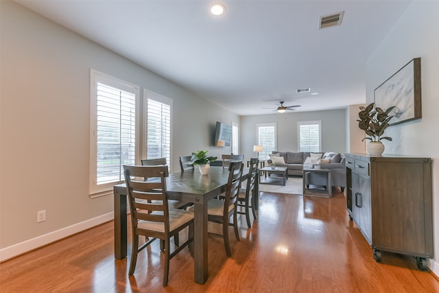 dining room with hardwood / wood-style floors and ceiling fan