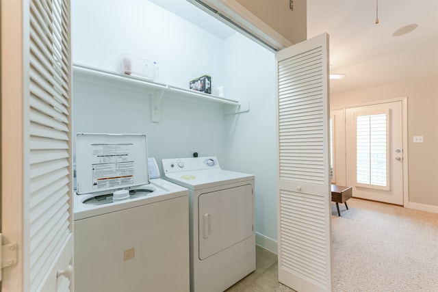 laundry room with light carpet and independent washer and dryer