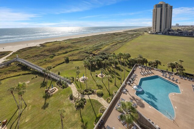 bird's eye view featuring a water view and a view of the beach