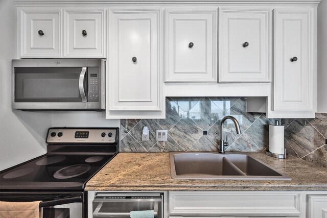 kitchen with white cabinetry and appliances with stainless steel finishes